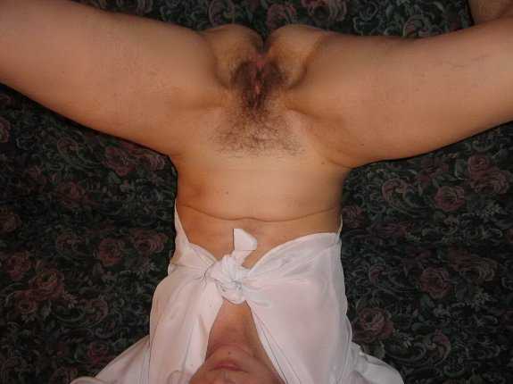 Mature woman shows her hairy pussy